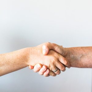 person holding hands of another person