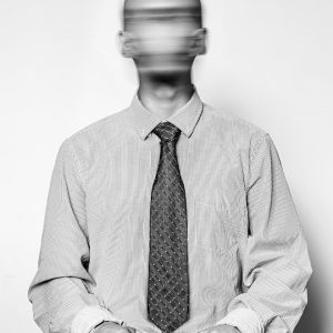 man in white dress shirt and black and white necktie